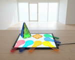 Colourful geometric shapes on a Light up board.
