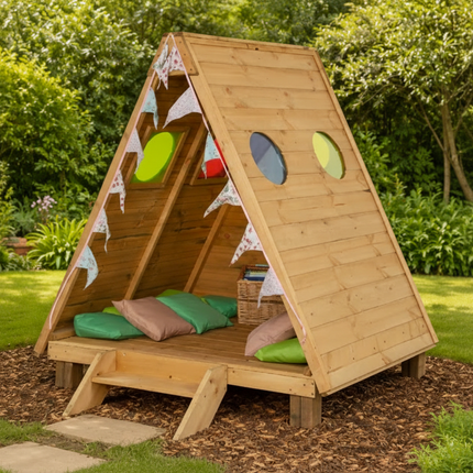 Wooden playhouse with colorful cushions in a garden setting