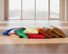 Colorful fabric squares stacked on a white background