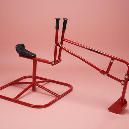 Red metal digger with a black seat on a red background