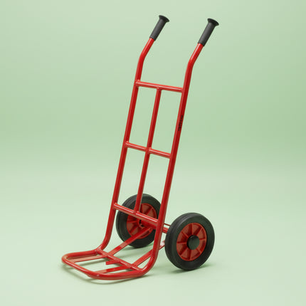 Red hand truck with black wheels on a white background
